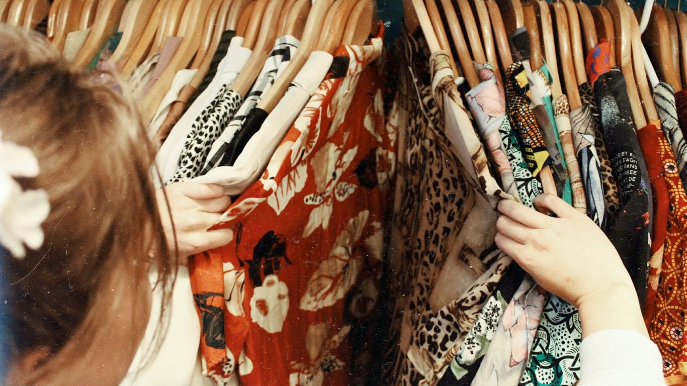 Woman choosing athletic apparel in store