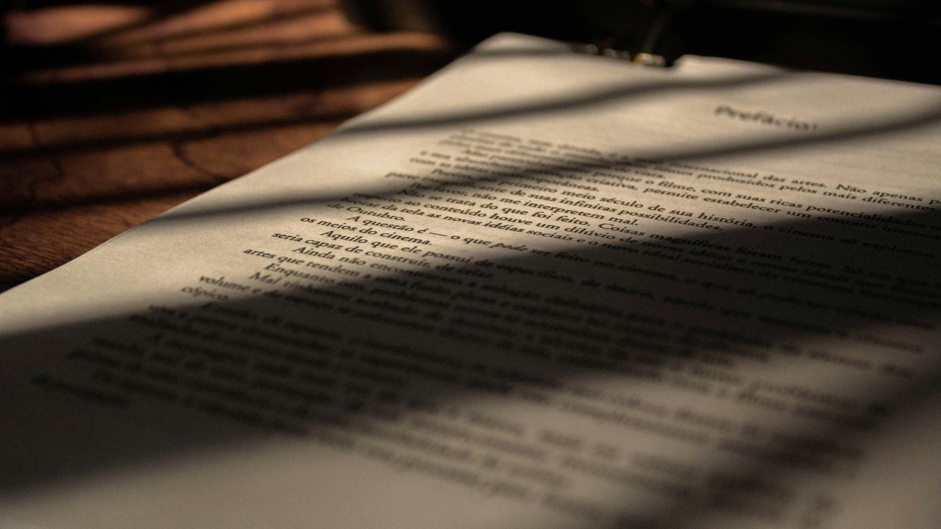 white book page on brown wooden table