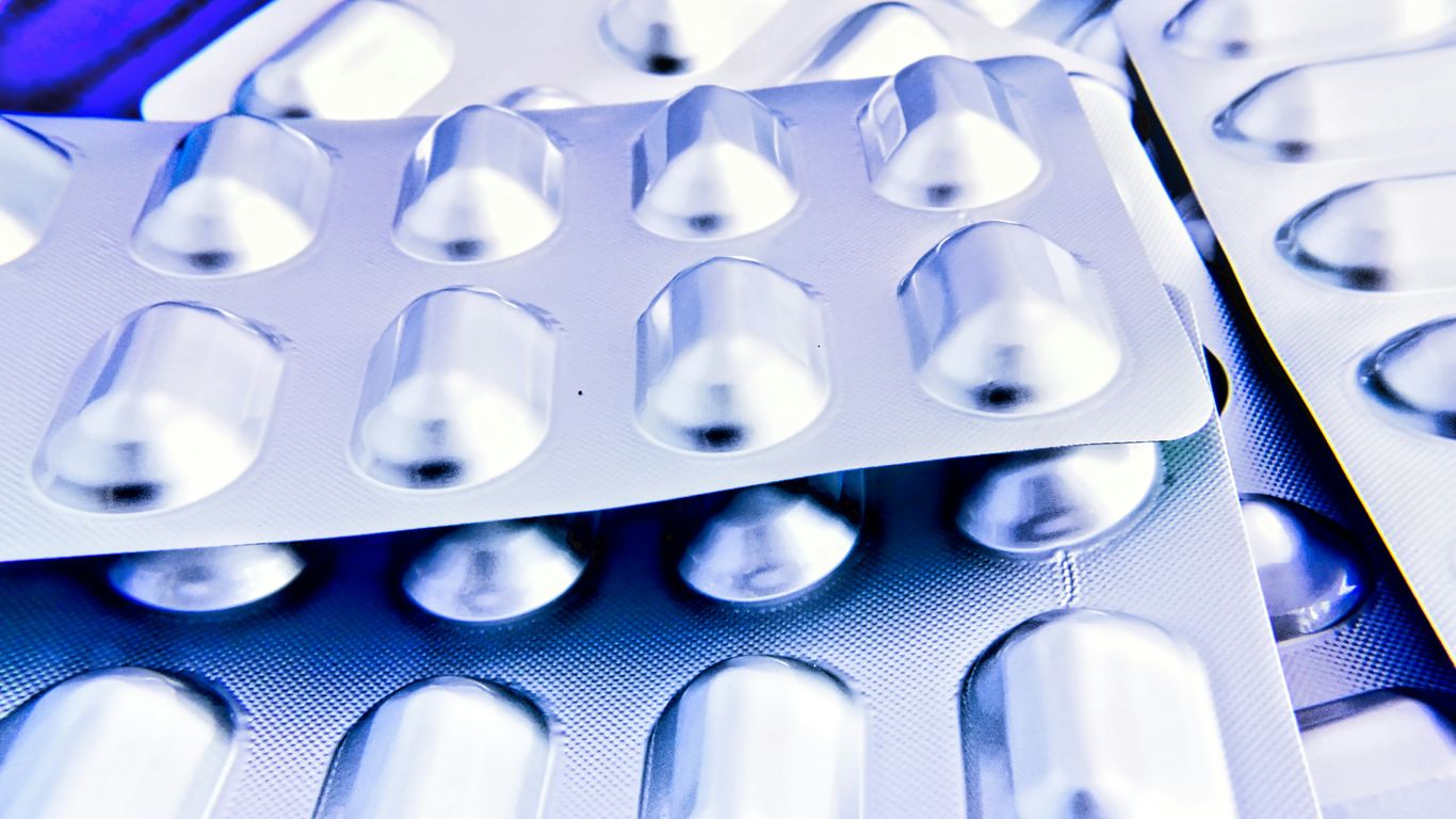 a close up of many pills in a blister