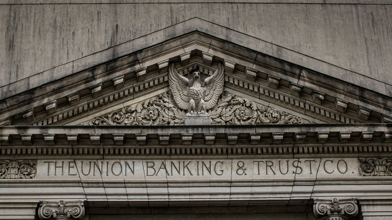 brown concrete building with statue