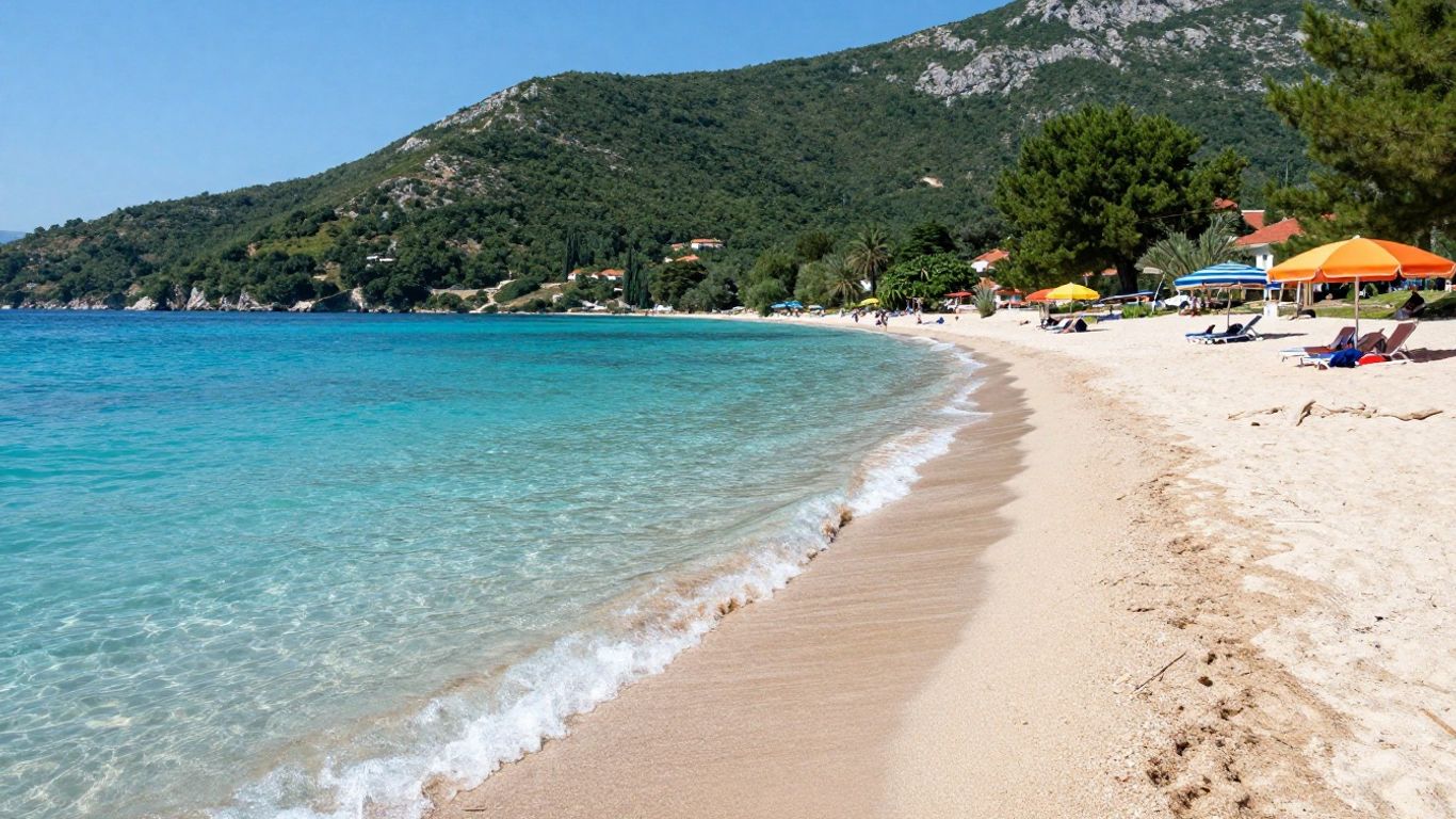 Bosnian beach with clear water and green hills.