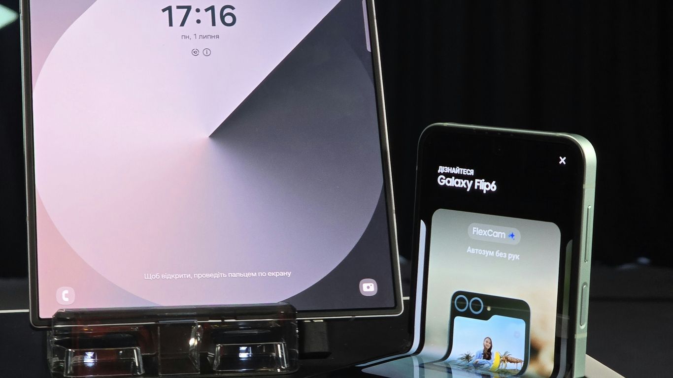 A cell phone and a laptop on a table