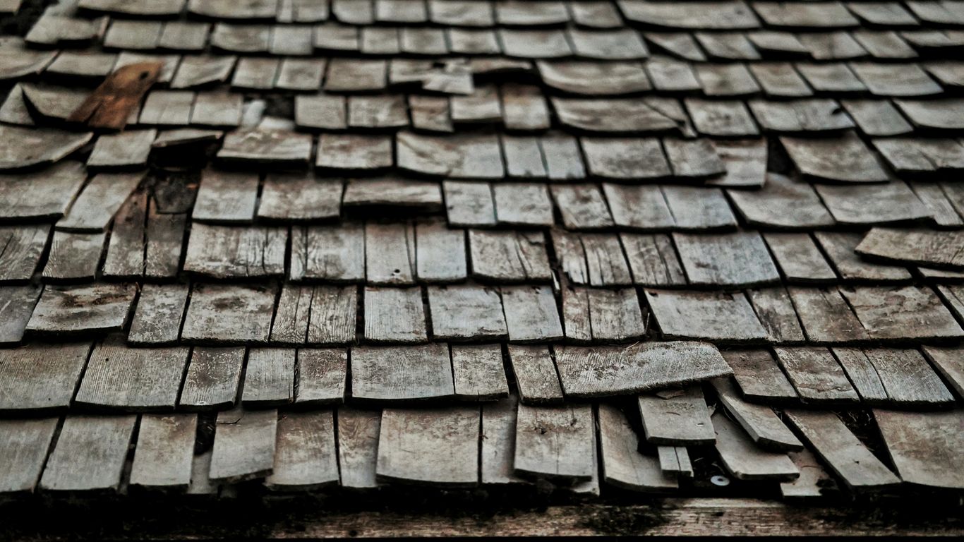 a cobblestone road with a brick walkway