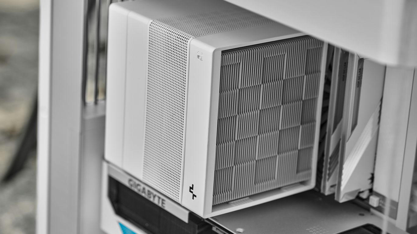 A white computer case with a checkered front panel.