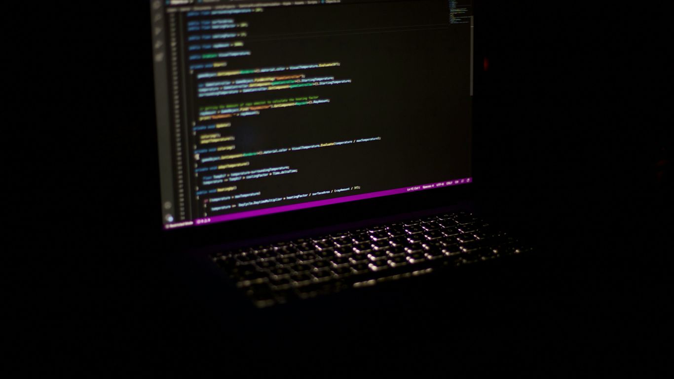 a laptop computer sitting on top of a table