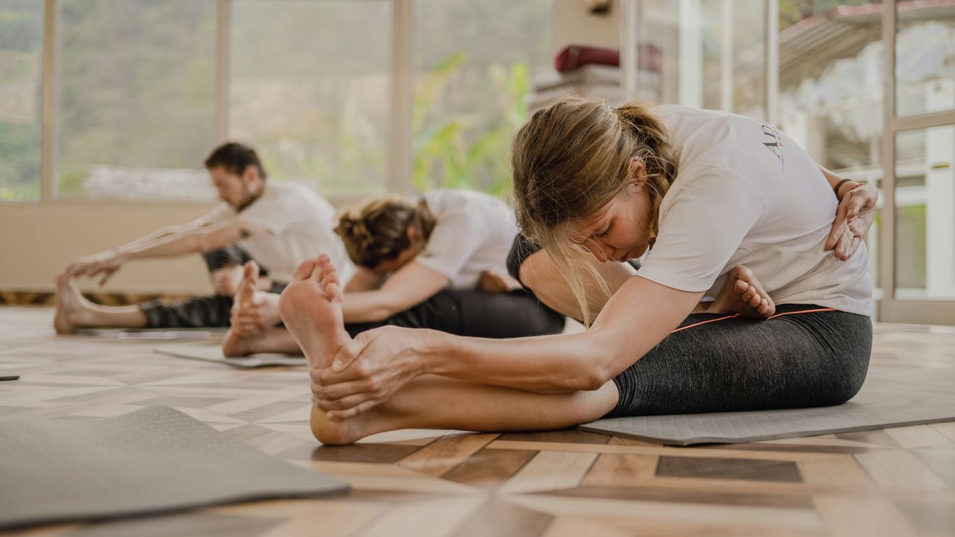 Person stretching on yoga mat