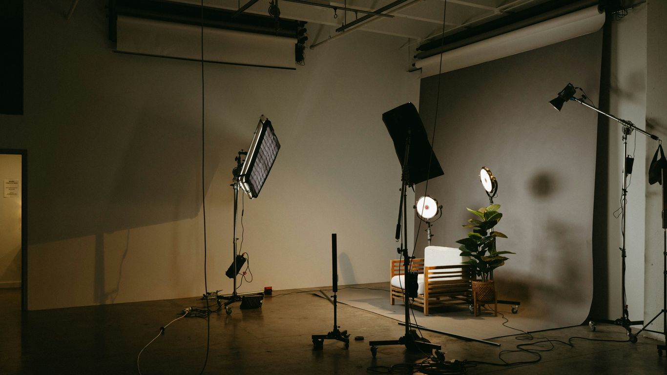 A clean studio setting focused on film equipment and lighting gear
