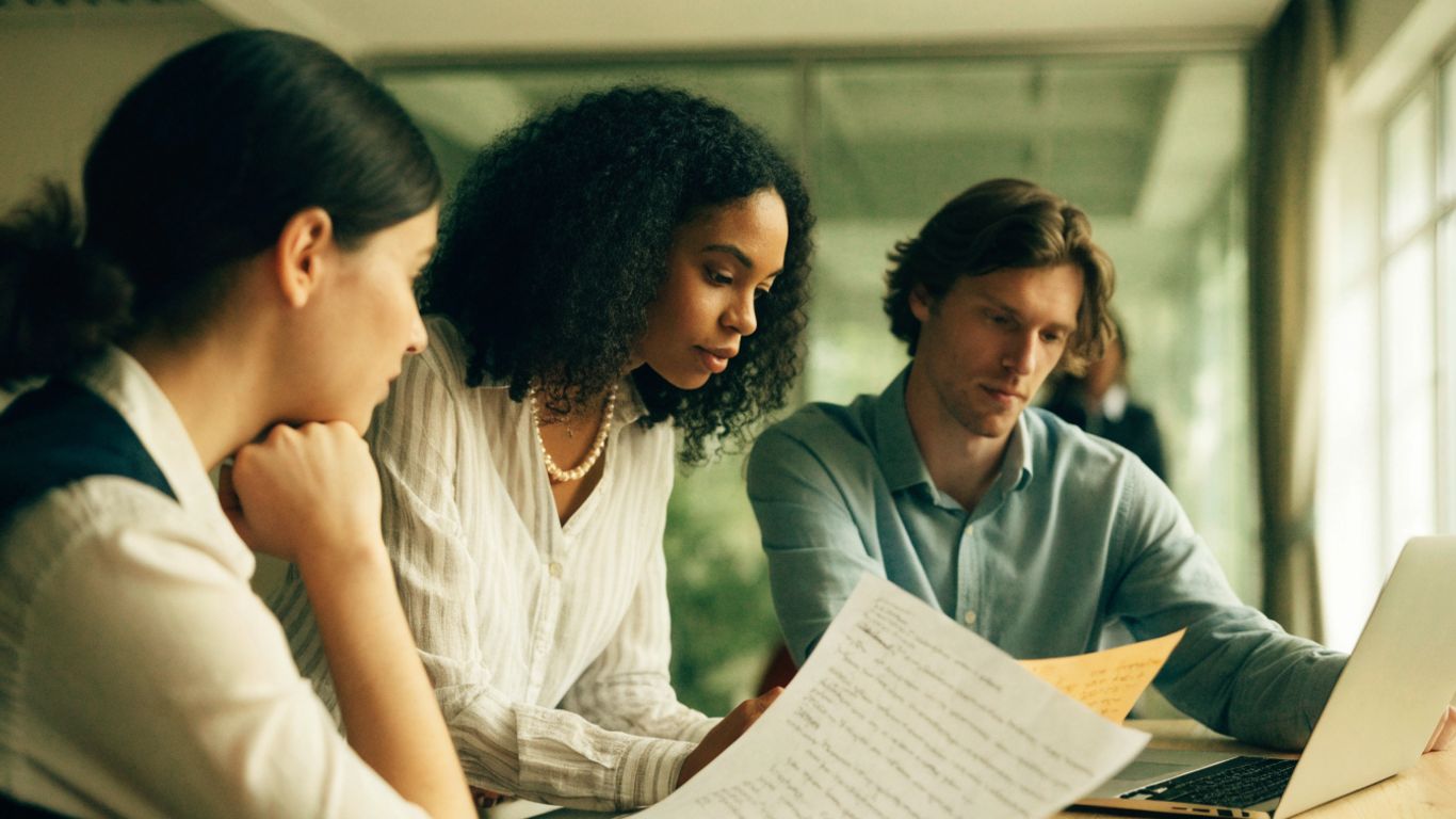 Service team reviewing customer follow-up notes together