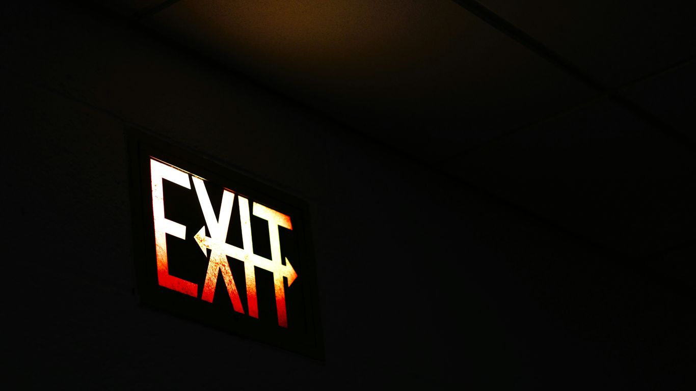 Illuminated exit sign in dark room