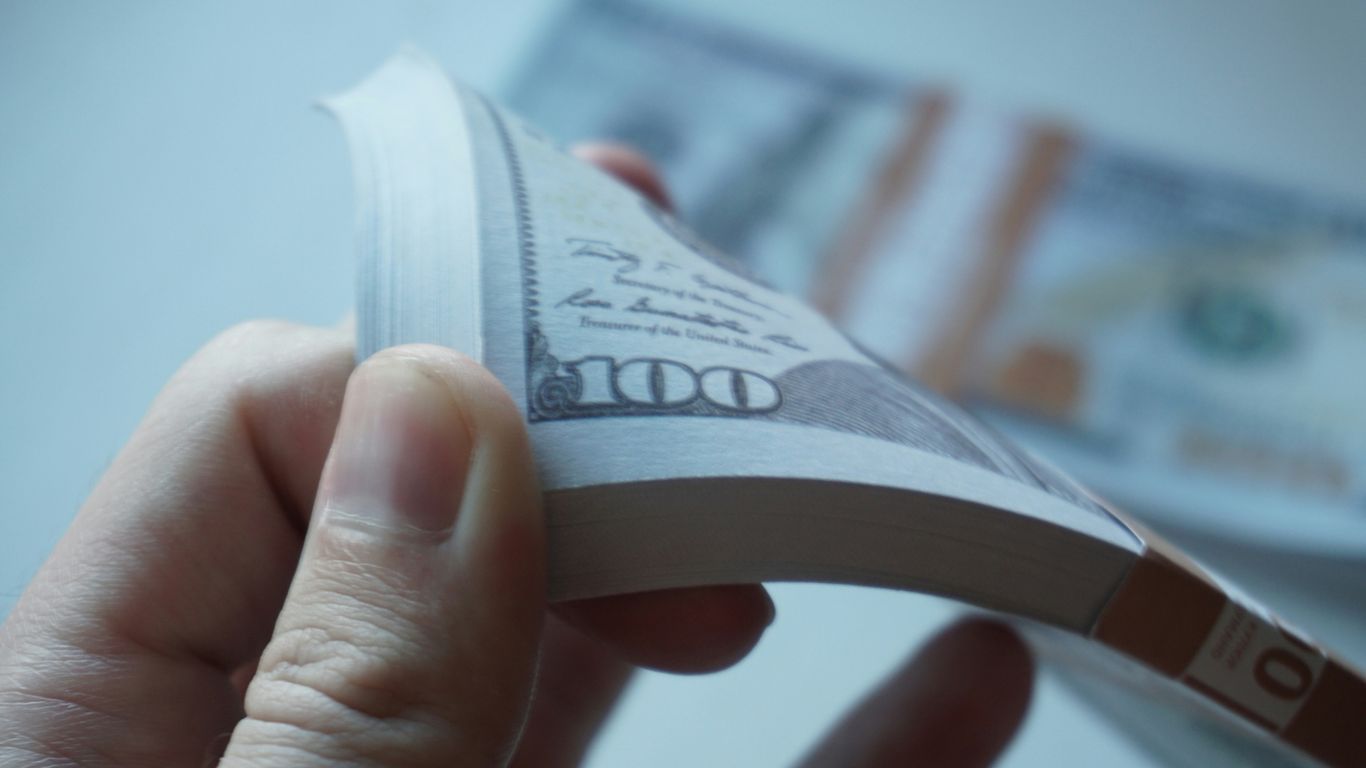 a person holding a bottle