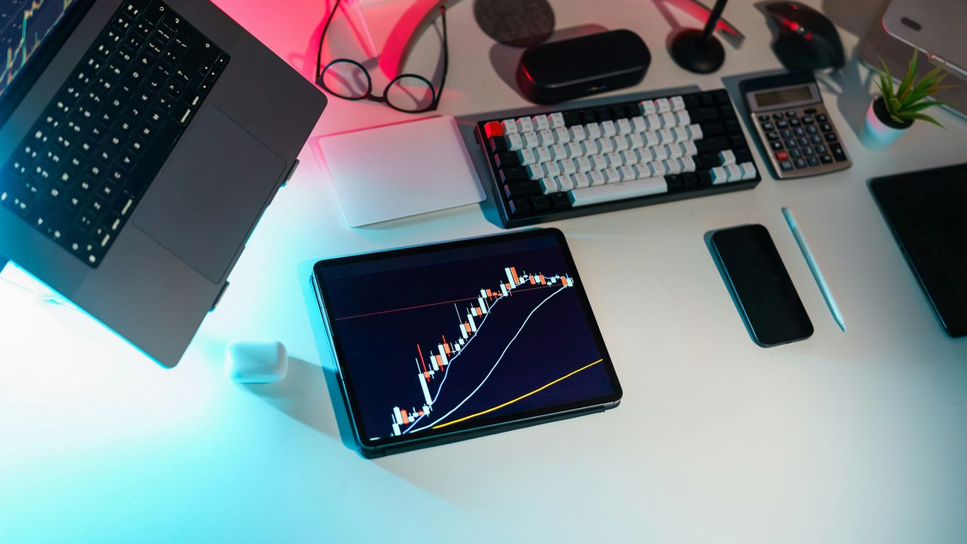 A laptop computer sitting on top of a white desk