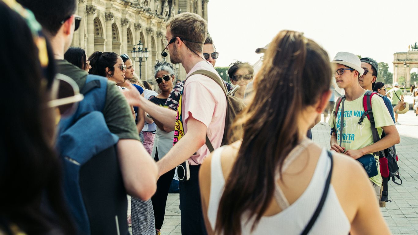 Tour guide explaining city history to visitors