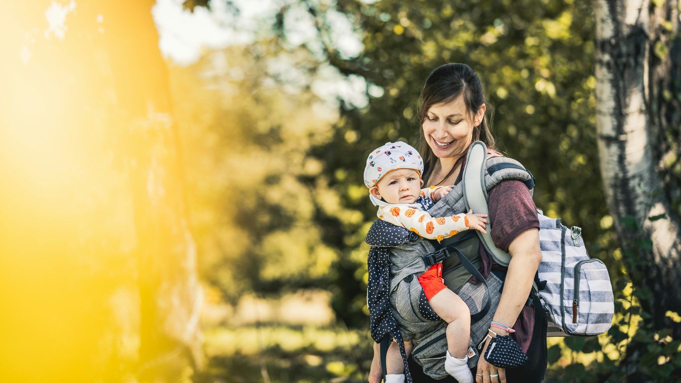a woman holding a child in her arms