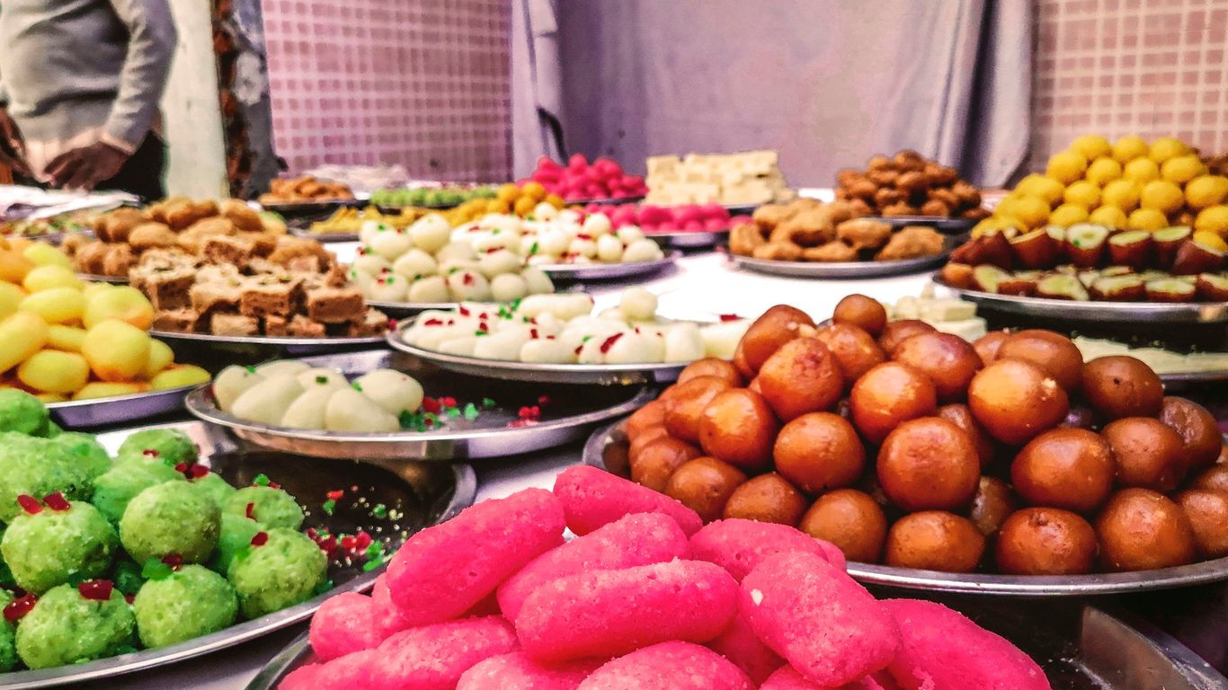 a table topped with lots of different types of donuts
