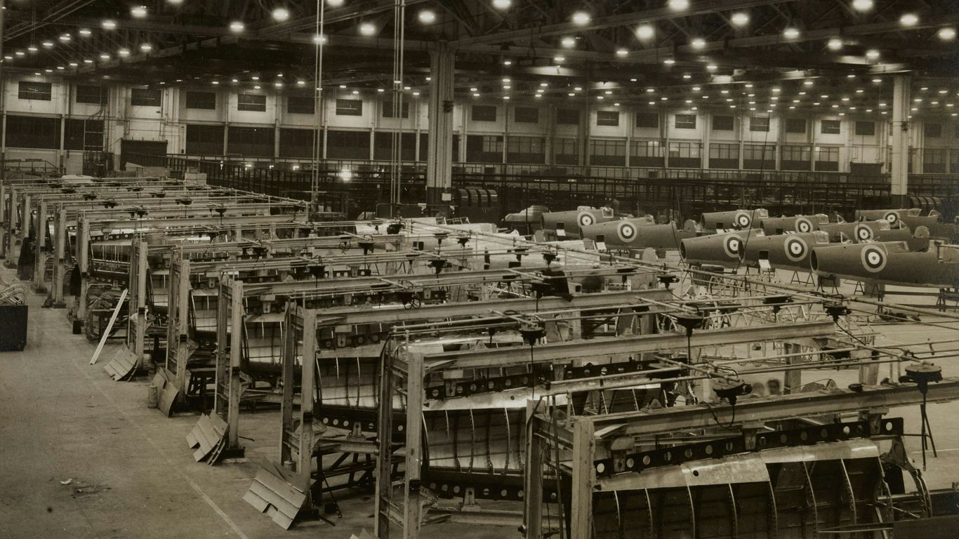 Warehouse interior with assembly lines for material handling equipment, showcasing organized machinery and production setup for efficient fulfillment operations.