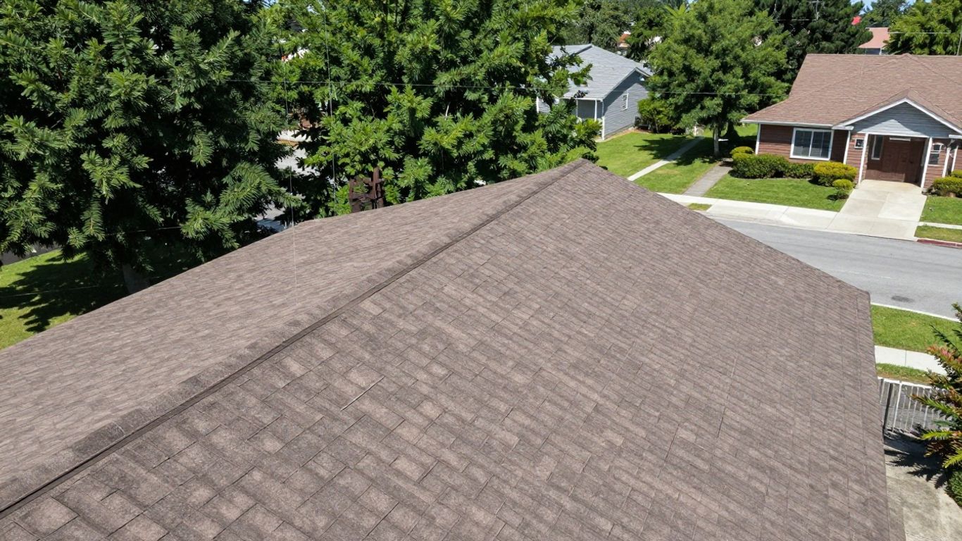 Satellite view of a house roof with measurement lines.