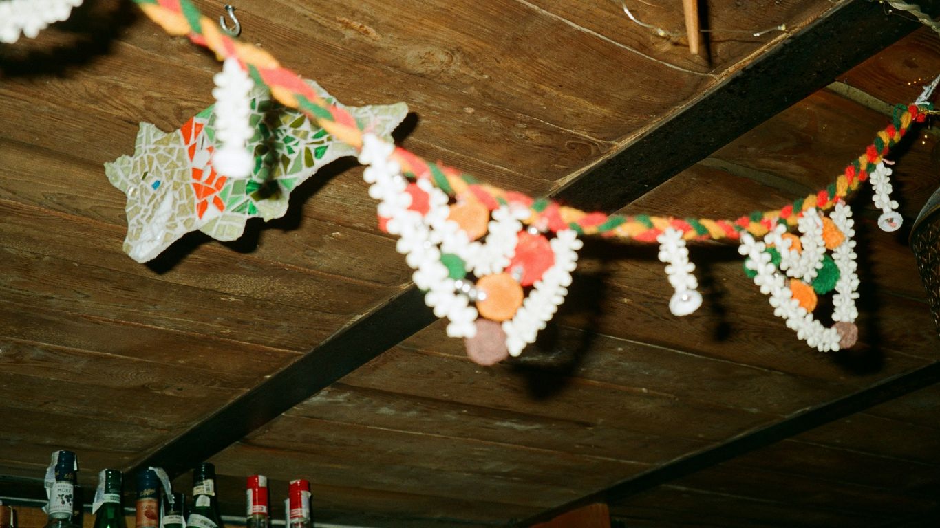 A string of paper decorations hanging from a ceiling