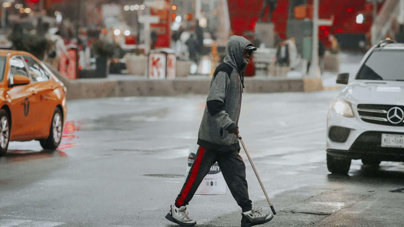 a person in a garment walking in the street