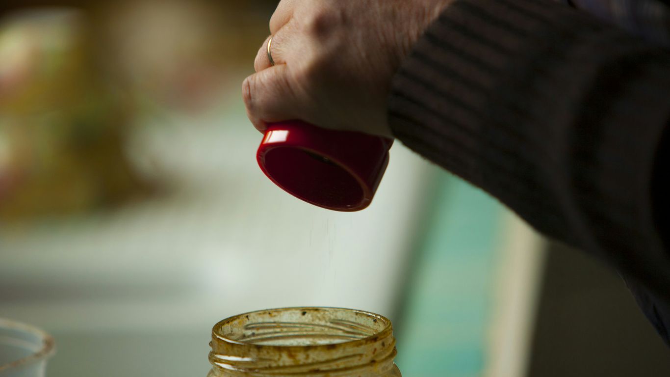 person holding red plastic cup