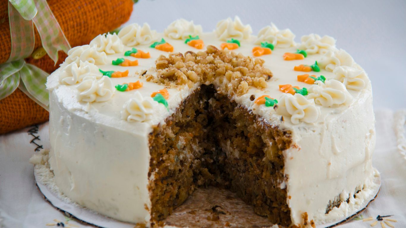 Freshly prepared carrot cake sitting on a vendor counter