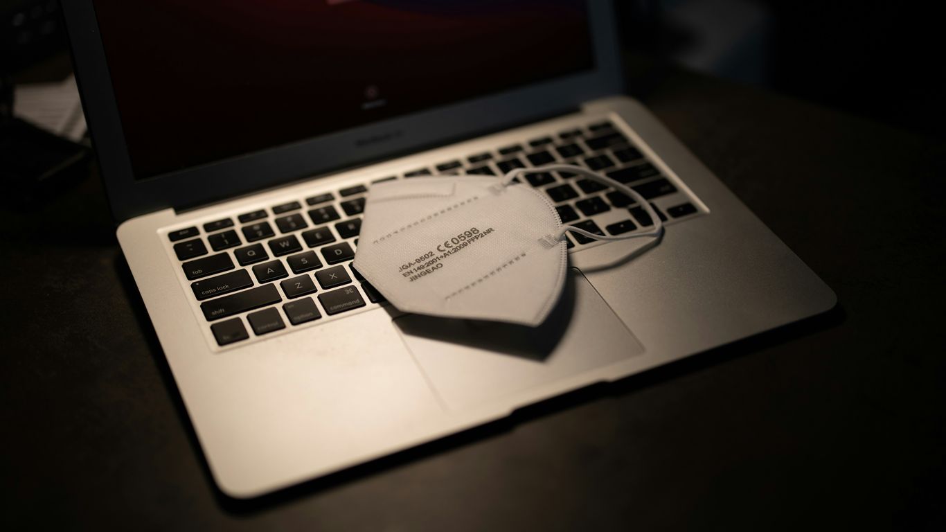 macbook pro on black table