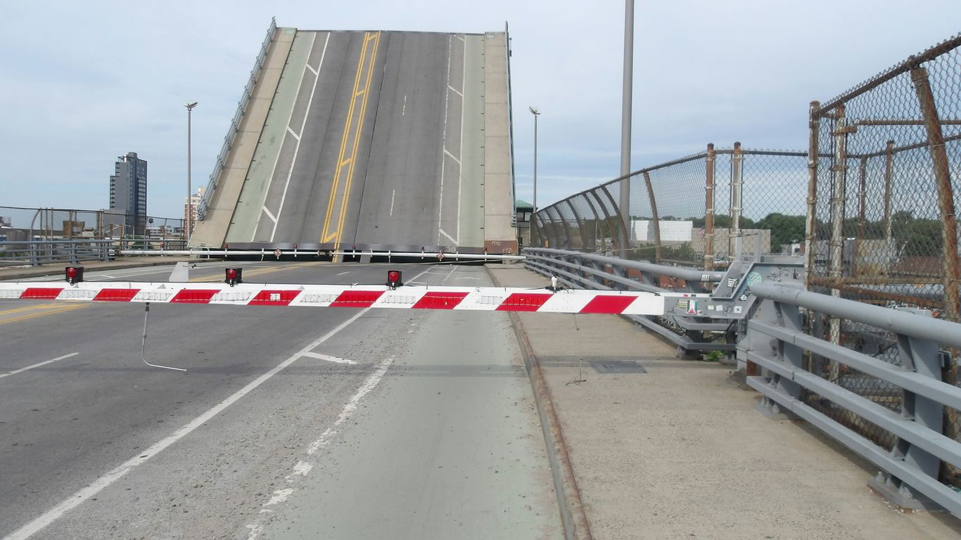 A large bridge with a red and white striped barrier