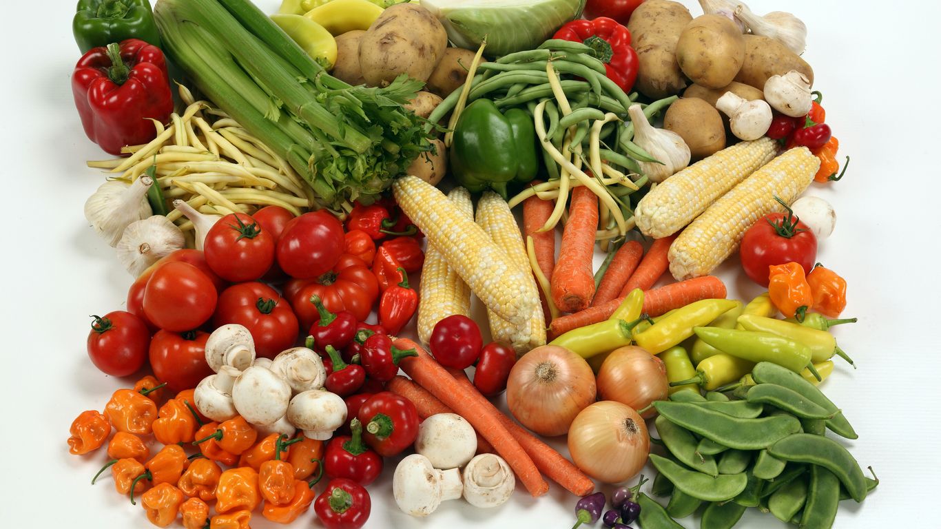 Fresh ingredients laid out for spice-heavy cooking