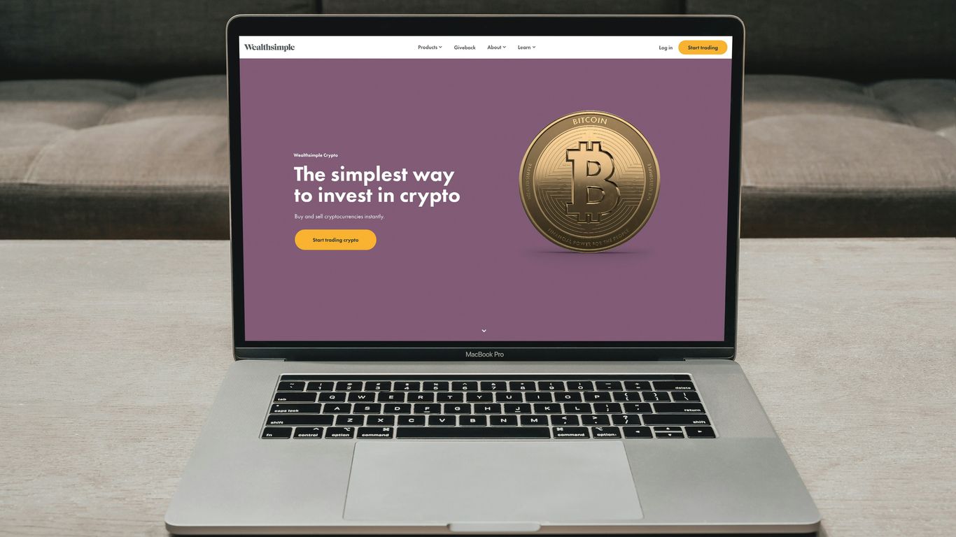 a laptop computer sitting on top of a table