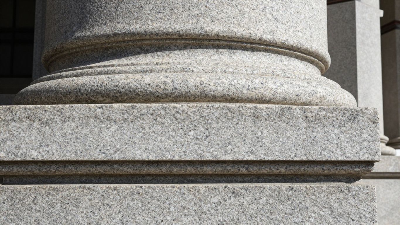 Polished granite building facade with natural patterns.