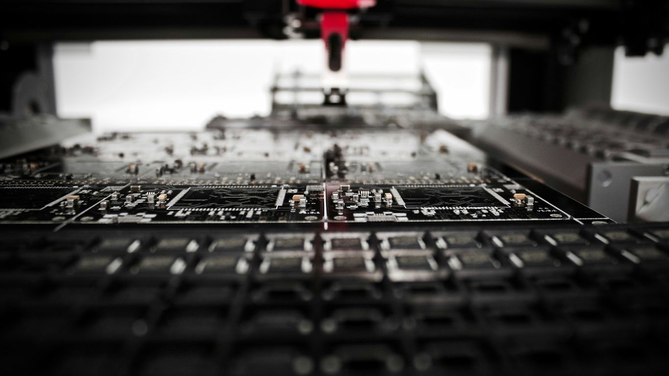 A bright lab with modular robotic components.