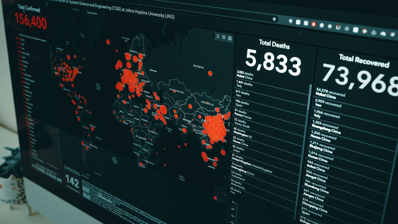 Logistics operators analyzing optimized shipping routes on digital interface