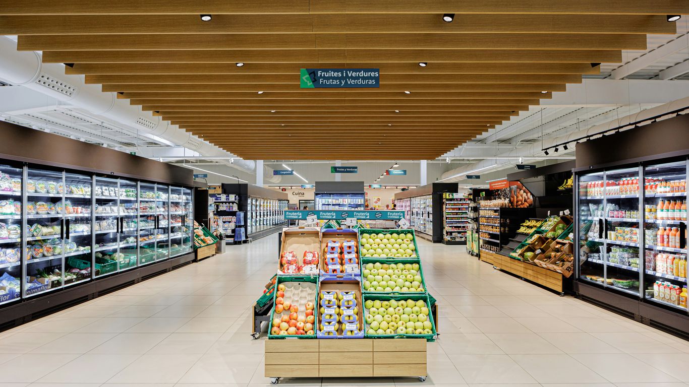 A clean modern retail storefront with clear stands