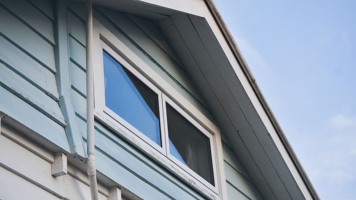 A close up of a house with a blue sky in the background