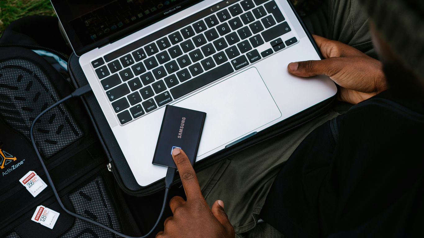 person holding silver and black laptop computer