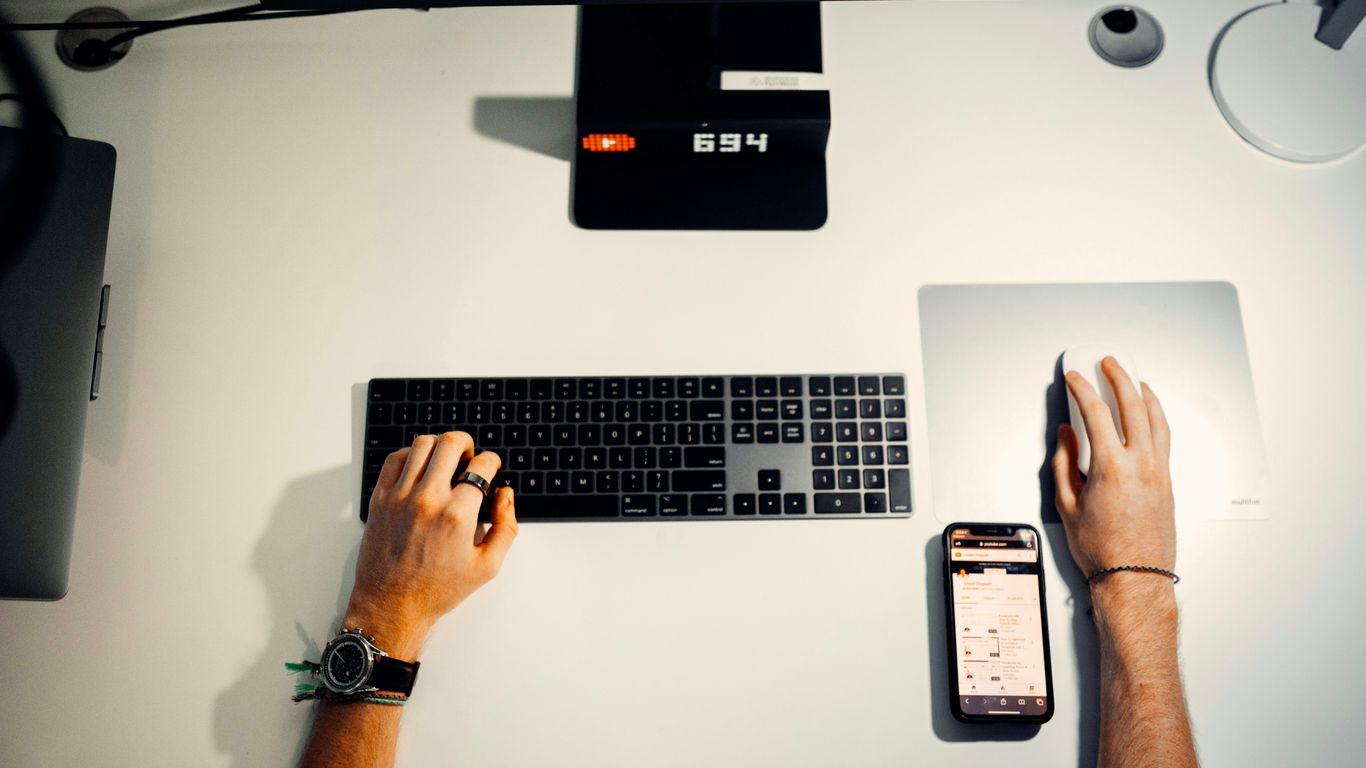 person holding silver and black laptop computer