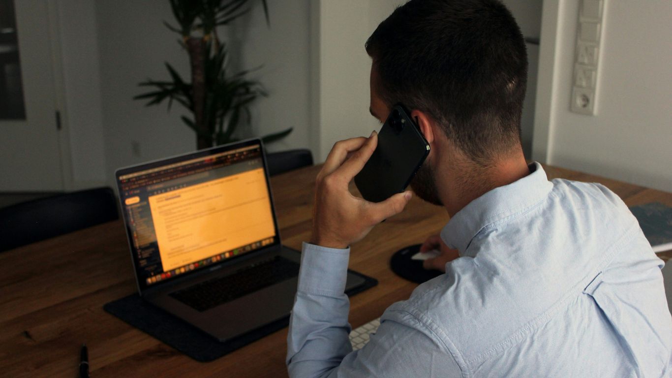 Tree service office manager answering a customer call
