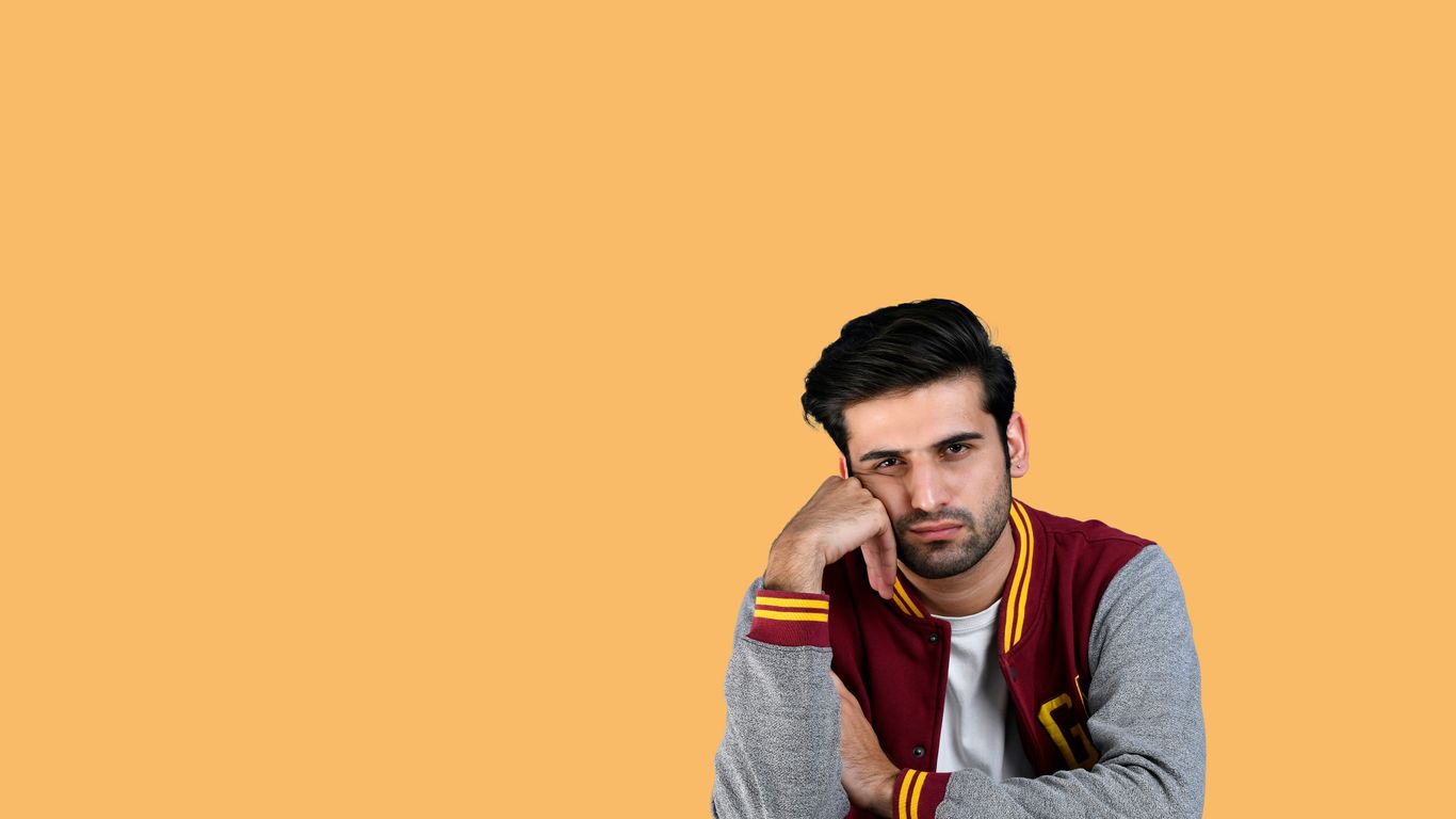 a man with his hand on his face