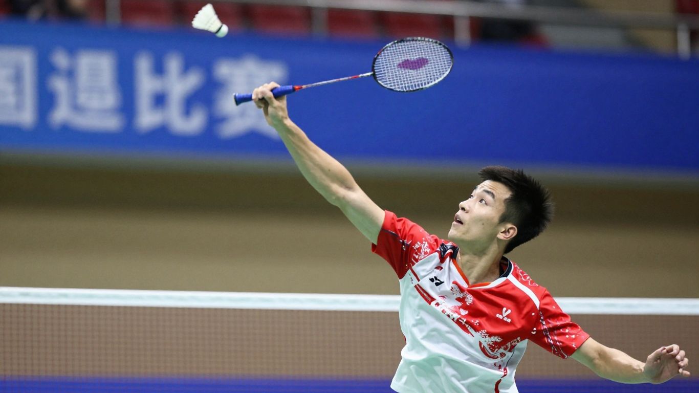 Badminton player executing a powerful smash shot.
