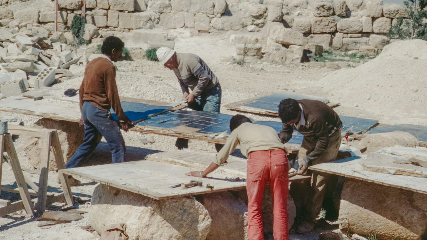 Stone specialist inspecting marble slab