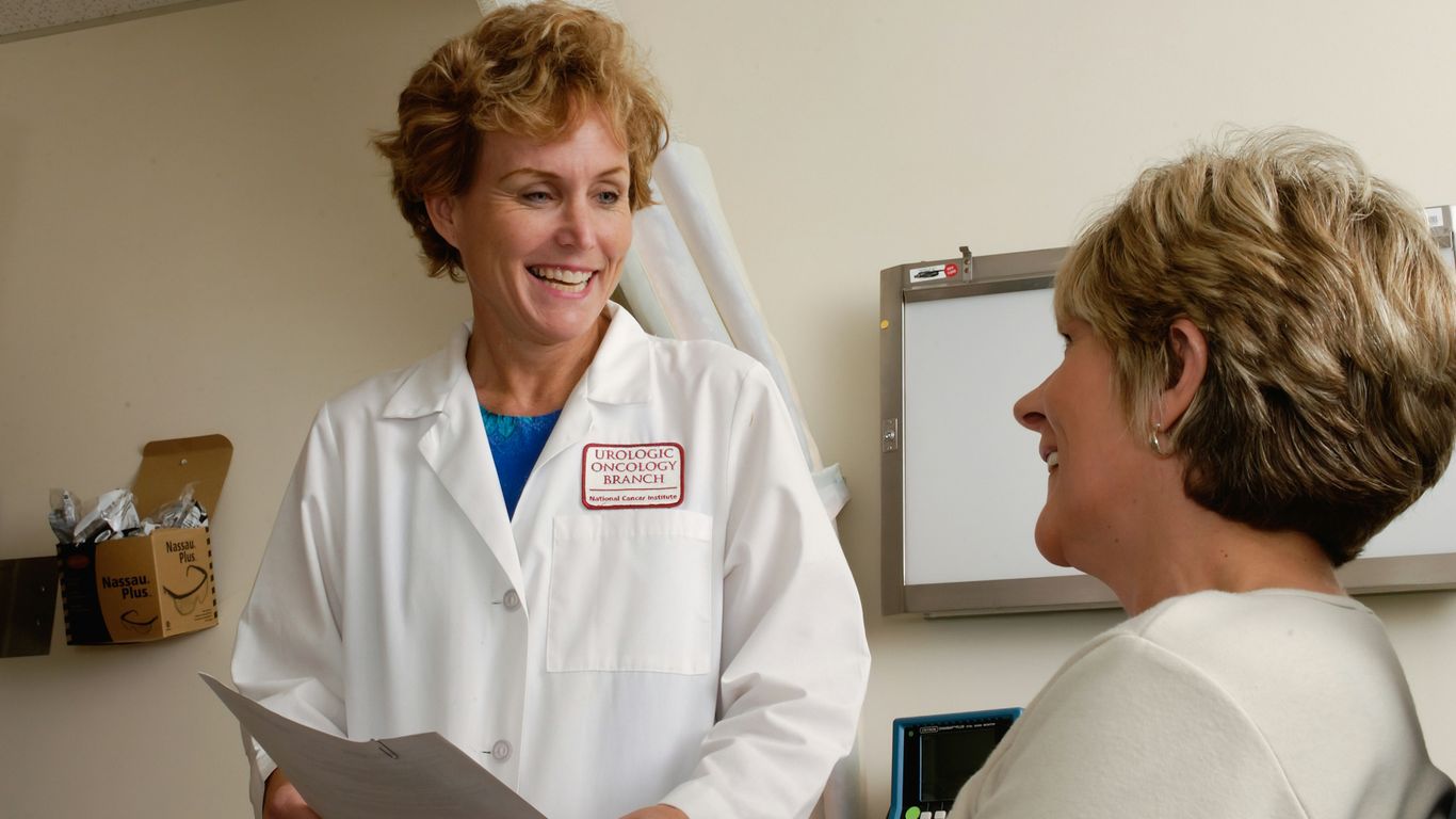 A professional clinician discussing treatment with a patient