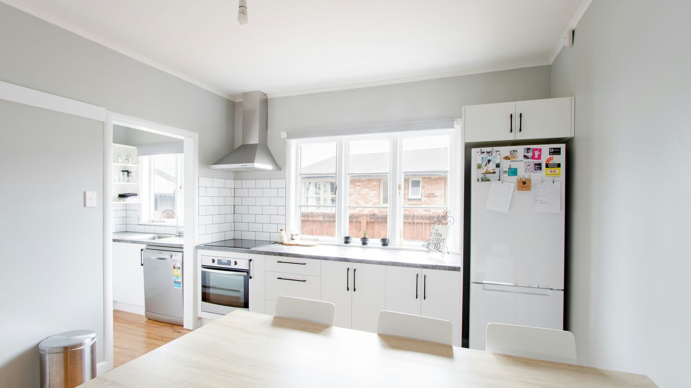white wooden table near white wooden framed glass window
