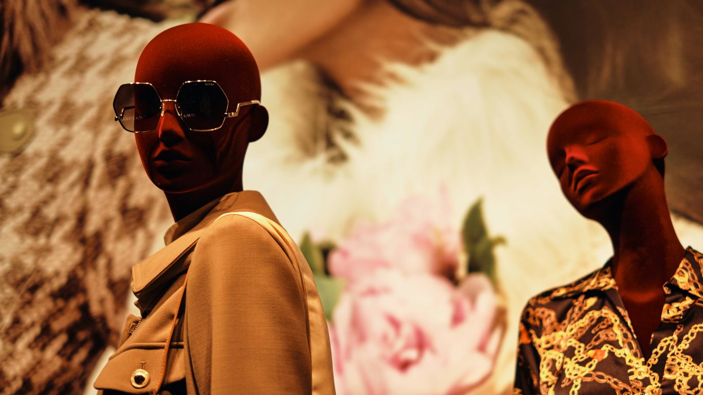 a couple of mannequins are standing next to each other