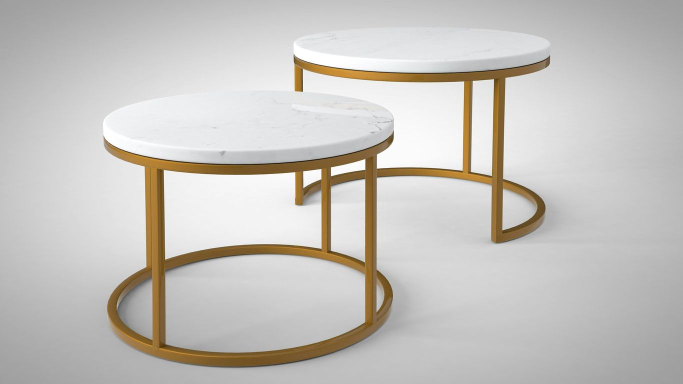 Stone coffee and side tables in layered arrangement