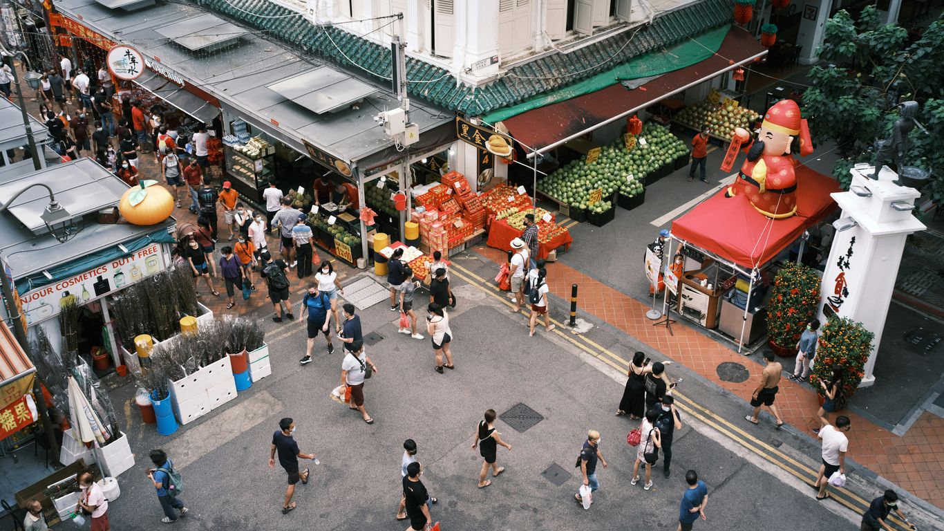 Morning market stalls beneath high ceilings