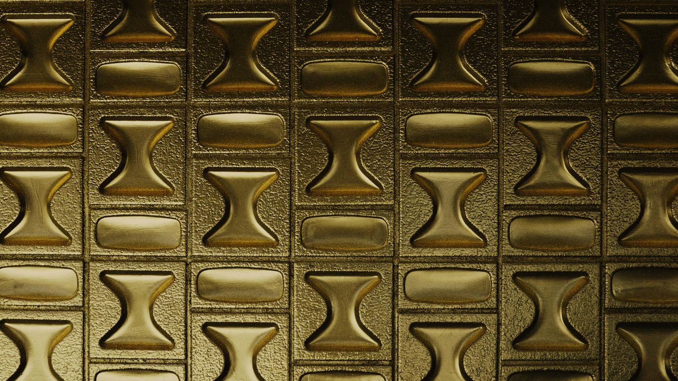 gold cross on black surface