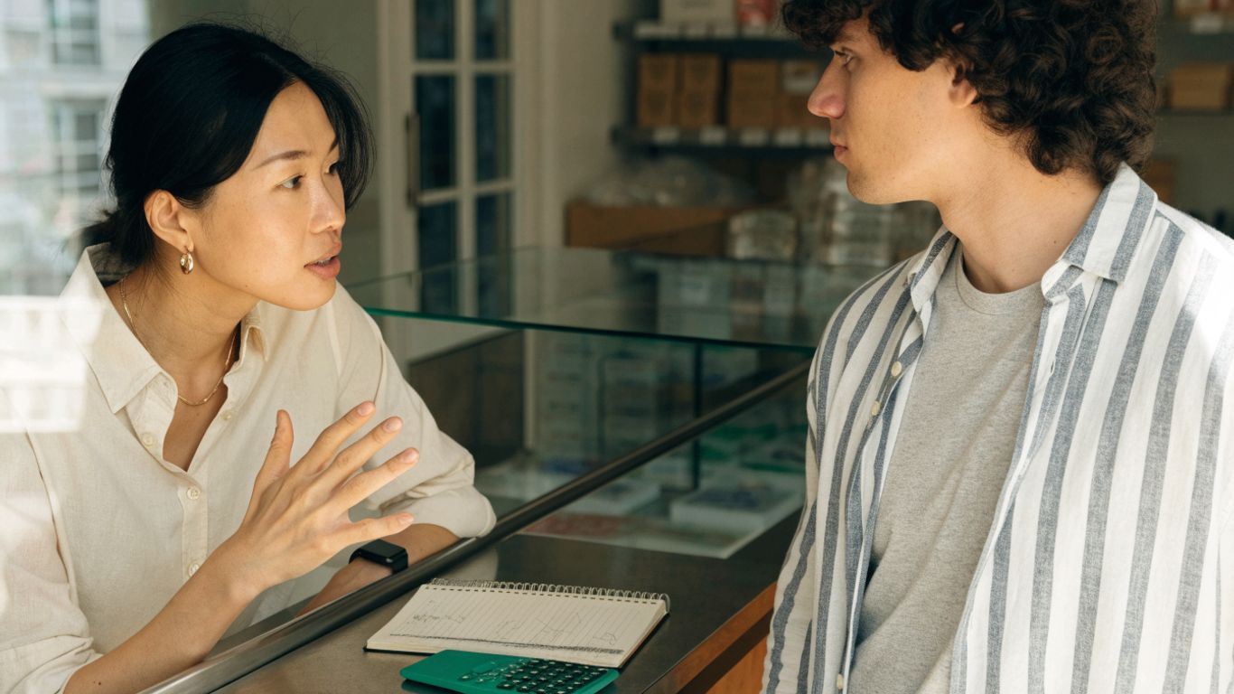 Business owner explaining pricing options to a customer
