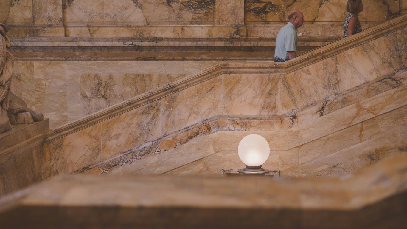 a couple of people standing on a set of stairs