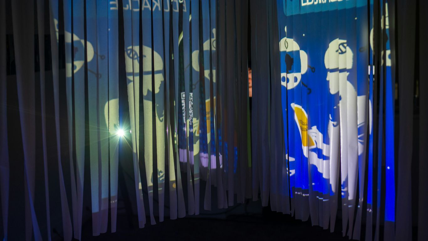 Projected graphics on a curved wall with curtains
