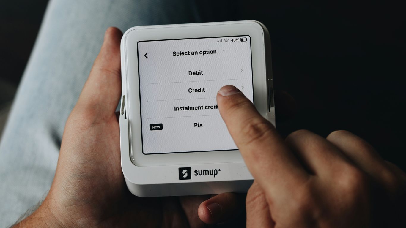 A person is holding a tablet in their hands