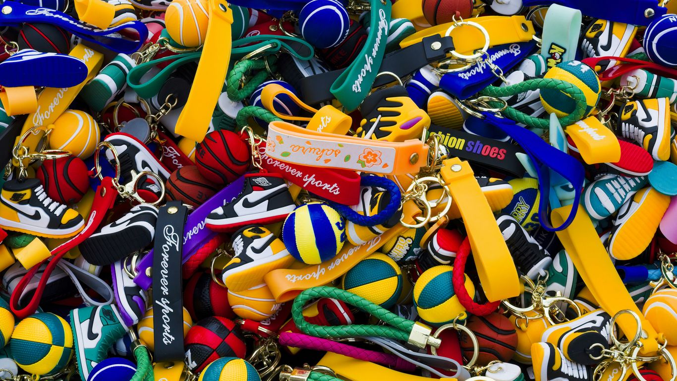 a large pile of assorted colorful key chains